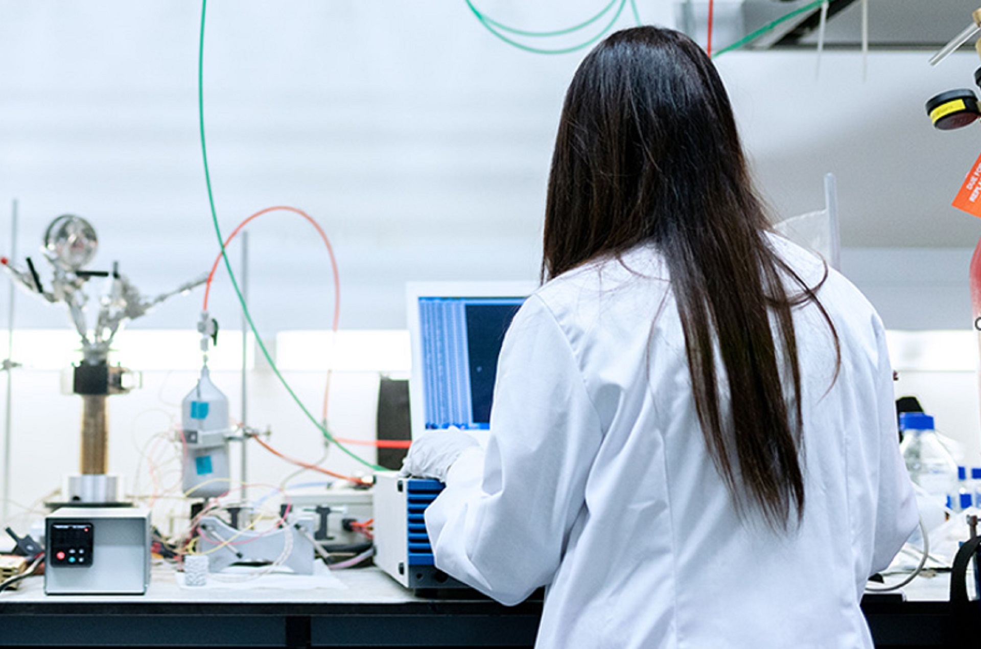 black hair woman working in a lab